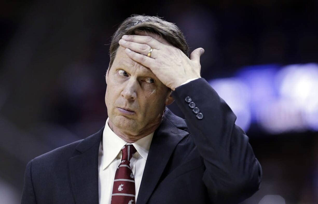 In this Feb. 28, 2014, photo, Washington State coach Ken Bone wipes his brow as he walks along the bench during the team's NCAA college basketball game against Washington in Seattle.