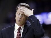 In this Feb. 28, 2014, photo, Washington State coach Ken Bone wipes his brow as he walks along the bench during the team's NCAA college basketball game against Washington in Seattle.