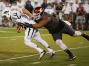 Washington State's Robert Barber (92) sacks Nevada's Cody Fajardo (17) during the first half Friday in Reno, Nev.