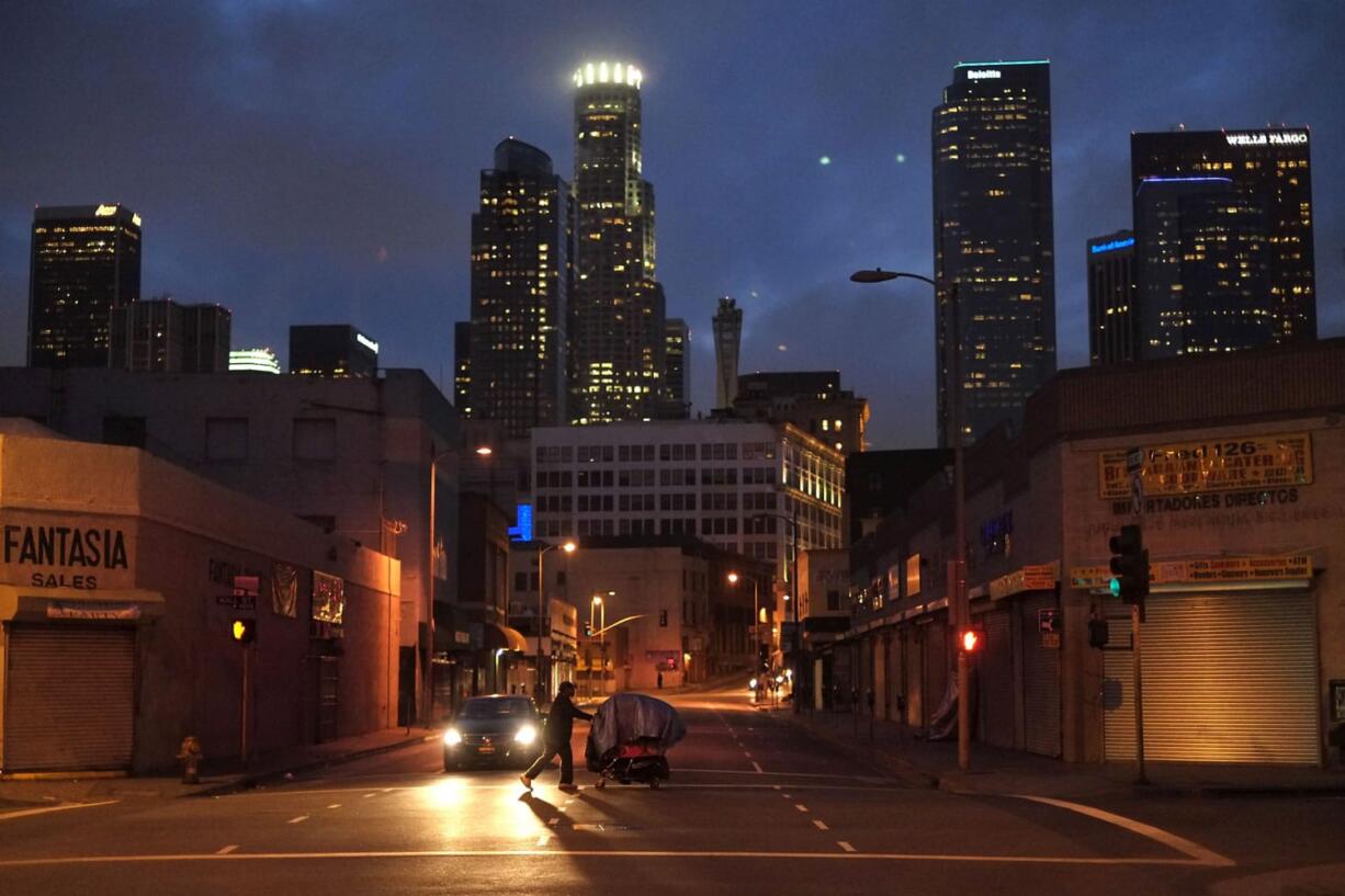 A homeless man pushes a shopping cart full of his belongings across an intersection in March in the Skid Row area of Los Angeles. From the White House to the Vatican to business leaders in Davos, Switzerland, one issue keeps seizing the agenda: the growing gap between the very wealthy and everyone else.