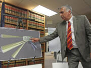 Salt Lake County District Attorney Sim Gill points out the angle trajectory of the fatal bullet, while discussing the findings of the investigation into the shooting of Danielle Willard during a news conference Aug. 8, in Salt Lake City. Gill announced that a single count of manslaughter had been filed against 33-year-old Shaun Cowley, a former narcotics officer in West Valley City on Thursday. Cowley and another officer fired at Danielle Willard as she backed her car out of a parking spot.