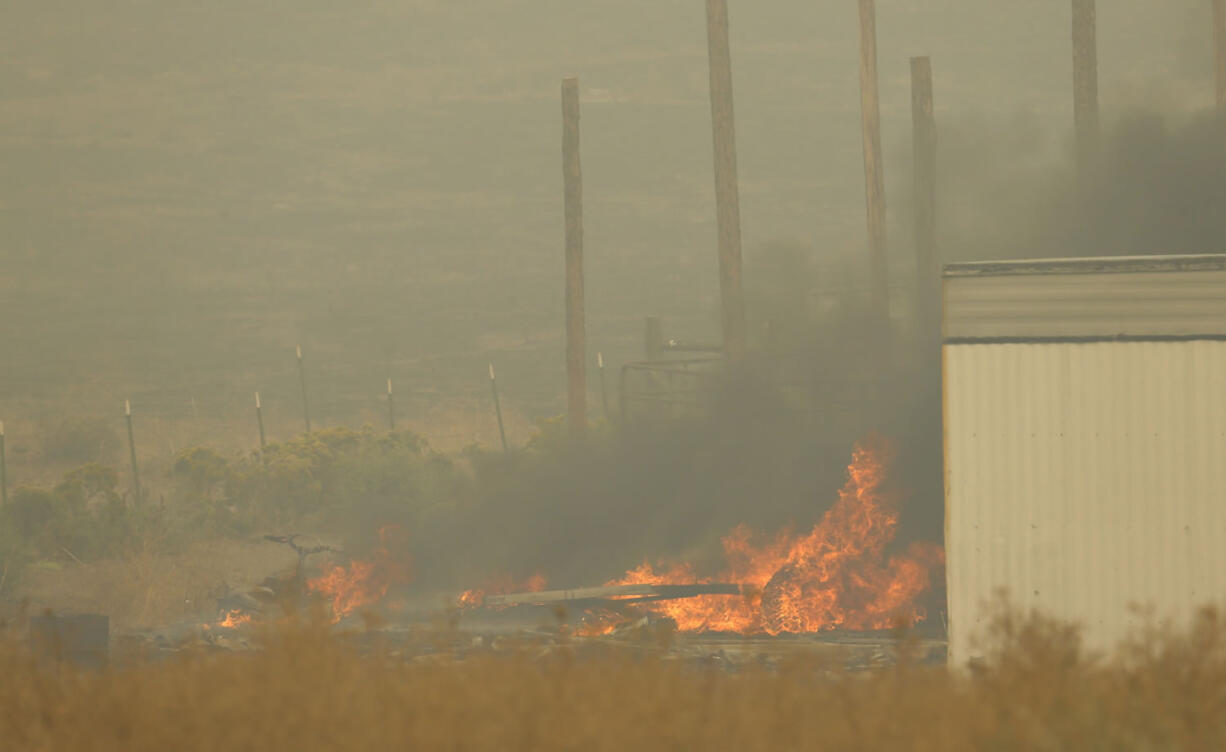 Wildfire has burned more than 20 percent of the land managed for timber on the Colville Reservation, leaving a hole in the tribes' budget. (AP Photo/Ted S.