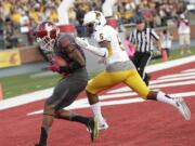 Washington State wide receiver Dom Williams (80) makes a catch for a touchdown against Wyoming cornerback Tyran Finley (5) during the first half Saturday, Sept. 19, 2015, in Pullman.