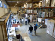 Local economic development officials including Vancouver Mayor Tim Leavitt, tour the First Aid Only company headquarters in Vancouver in January 2012.