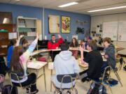 Ridgefield: Students in Jill Uhacz's language arts class choose who would be kicked out of a hypothetical bomb shelter during a recent lesson on perceptions of right and wrong.