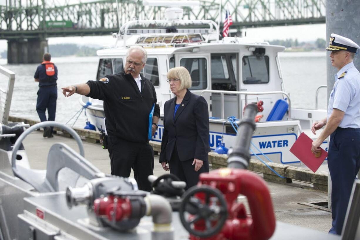 U.S. Sen. Patty Murray tours Vancouver Fire's new rescue boat with Battalion Chief Steve Eldred after a dedication ceremony, Friday, May 16, 2014.