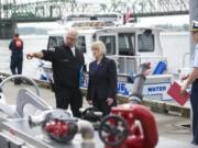 U.S. Sen. Patty Murray tours Vancouver Fire's new rescue boat with Battalion Chief Steve Eldred after a dedication ceremony, Friday, May 16, 2014.