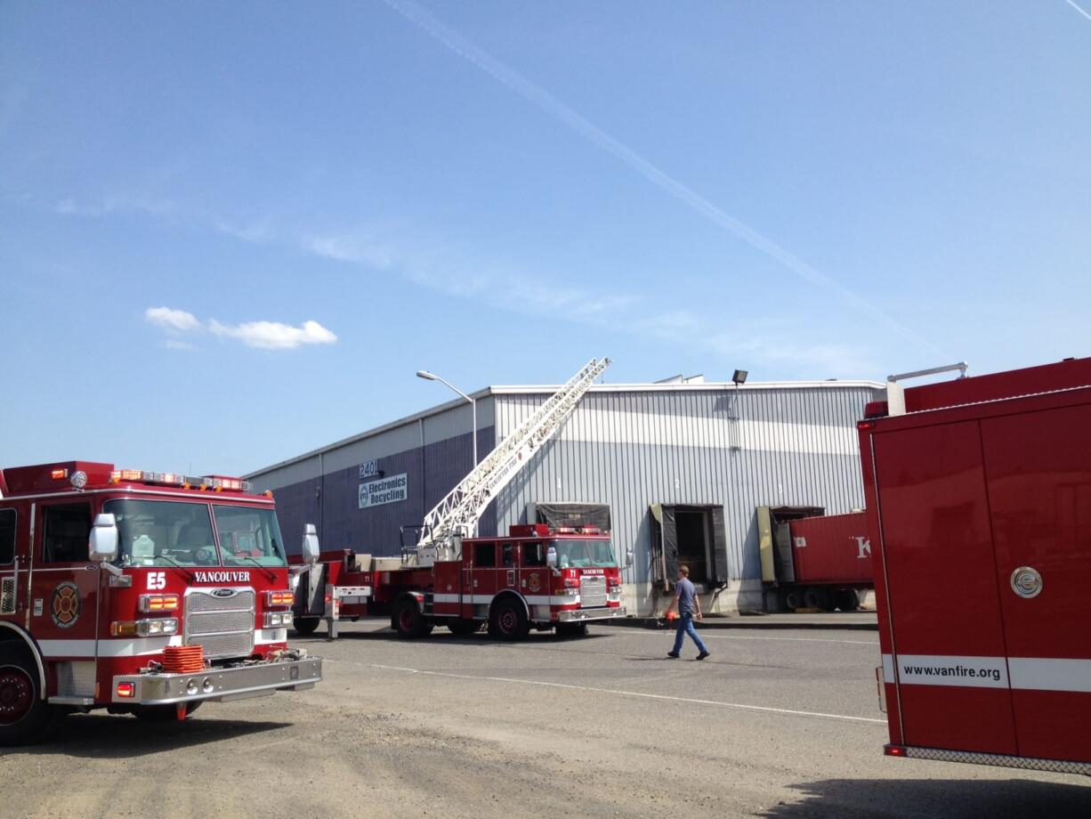 Crews from the Vancouver Fire Department work at the scene of a two-alarm commercial fire at IMS Electronics Recycling, 2401 Saint Francis Lane, in the Fruit Valley neighborhood.