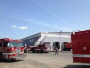 Crews from the Vancouver Fire Department work at the scene of a two-alarm commercial fire at IMS Electronics Recycling, 2401 Saint Francis Lane, in the Fruit Valley neighborhood.