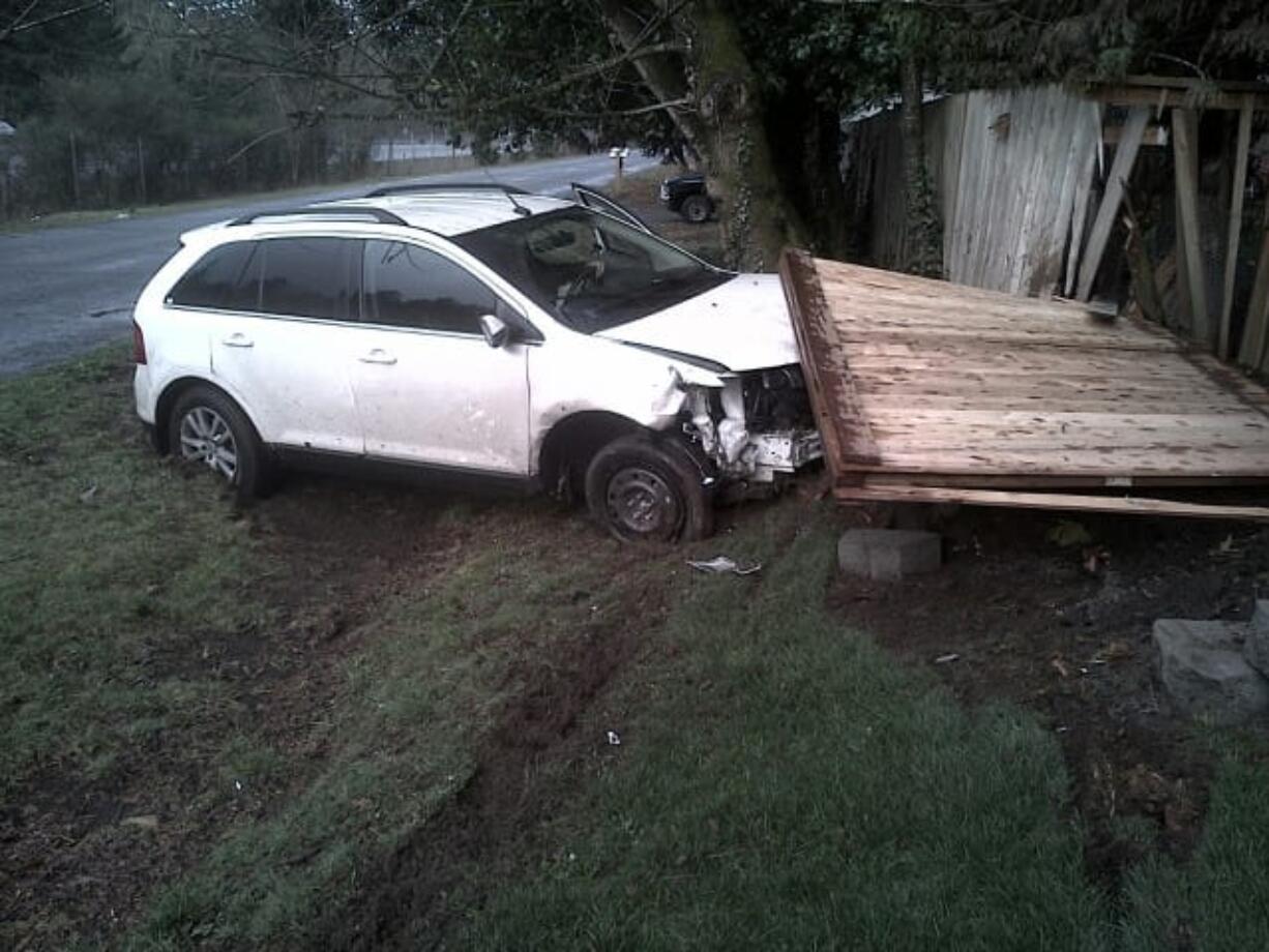 A Battle Ground man was driving while talking on a cell phone when his vehicle left state Highway 14 and crossed another street before crashing into a fence.