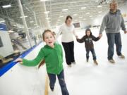 The Yamov family, from left, Christina, 7, Yuliya, Max, 5, and Nick skate at the Mountain View Ice Arena.