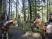 From left, Bobbi Luper, Anita Will and Betty Espey ride the Whipple Creek Park Trail on March 22.