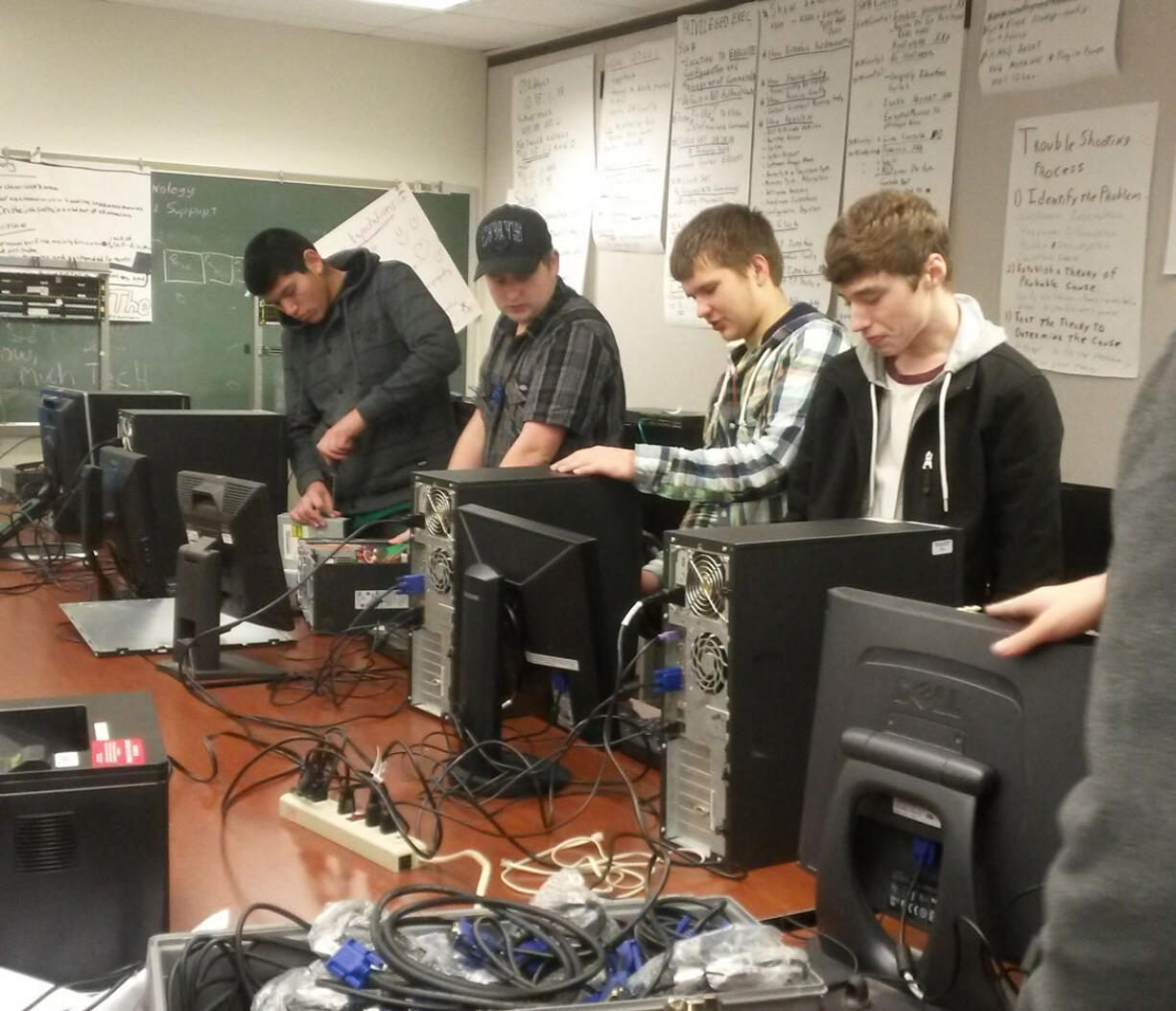 Image: Students from the Clark County Skills Center's IT System, Service and Support program test and erase data from computers donated as &quot;e-waste.&quot; The students collected 3,500 pounds of electronic waste to be recycled by Earth Friendly Recycling.