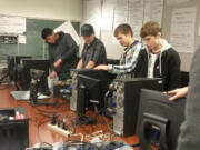 Image: Students from the Clark County Skills Center's IT System, Service and Support program test and erase data from computers donated as &quot;e-waste.&quot; The students collected 3,500 pounds of electronic waste to be recycled by Earth Friendly Recycling.