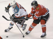 Kelowna Rockets Kris Schmidli, battles for the puck along with Portland Winterhawks, Alex Schoenborn during WHL playoff action at Prospera Place on Friday evening.