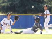 East County's Alex Orr, left, awaits the throw against a West Salem runner in the Little League Junior Boys Western Region tournament, played at Clark College in July 2014.