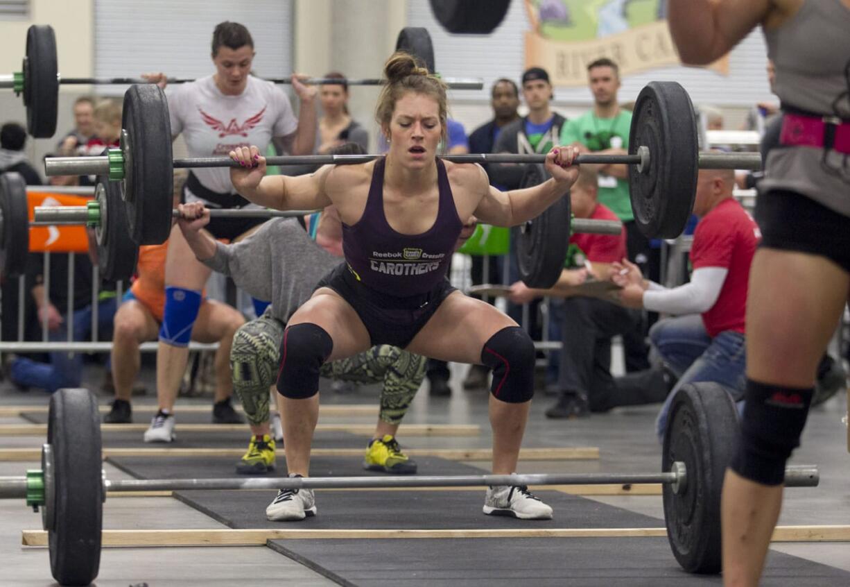 Rory Zambard does a squat lift as she competes Saturday in the CrossFit Fort Vancouver Invitational at the Clark County Event Center in Ridgefield.