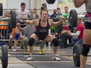 Rory Zambard does a squat lift as she competes Saturday in the CrossFit Fort Vancouver Invitational at the Clark County Event Center in Ridgefield.