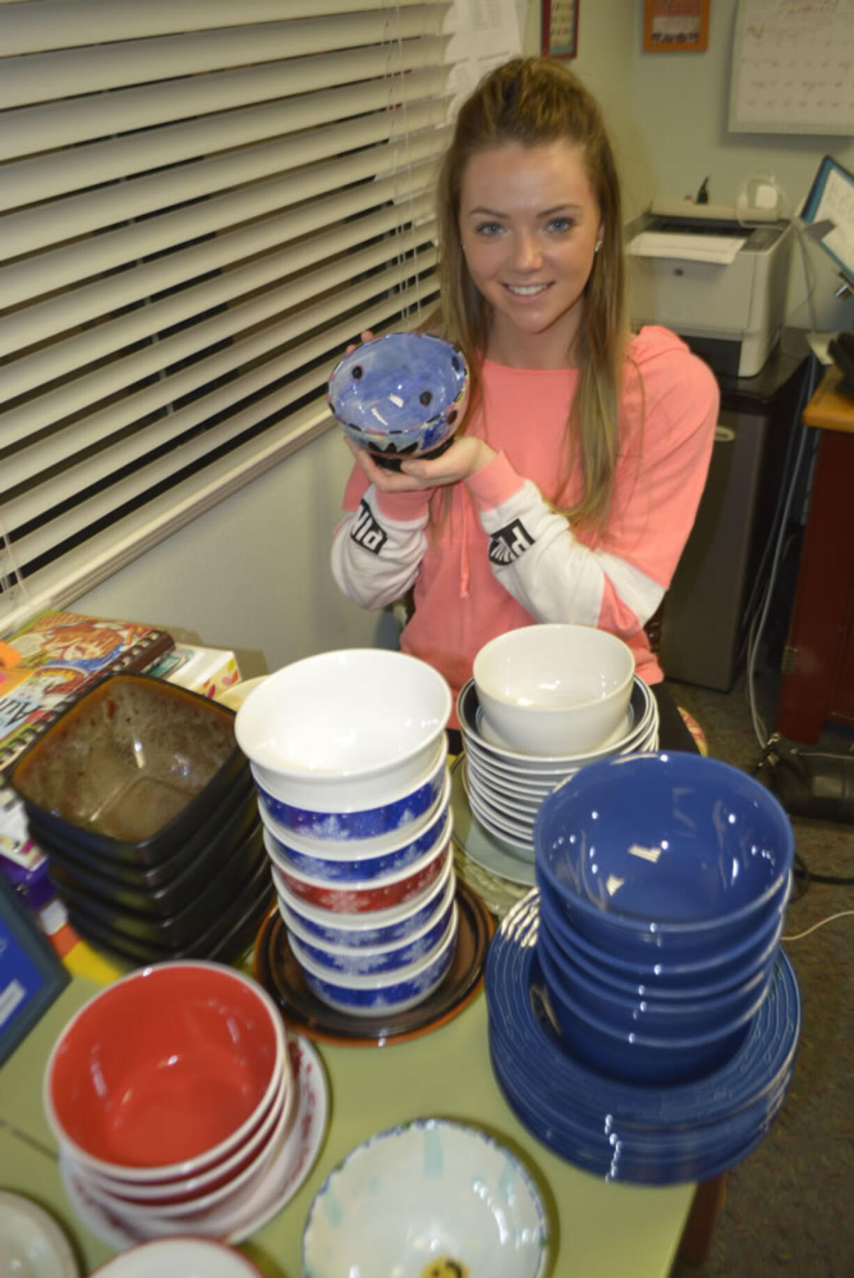 McKenzie Kitchen holds one of the many bowls that will be given to those attending a soup dinner fund raiser at Excelsior High School.