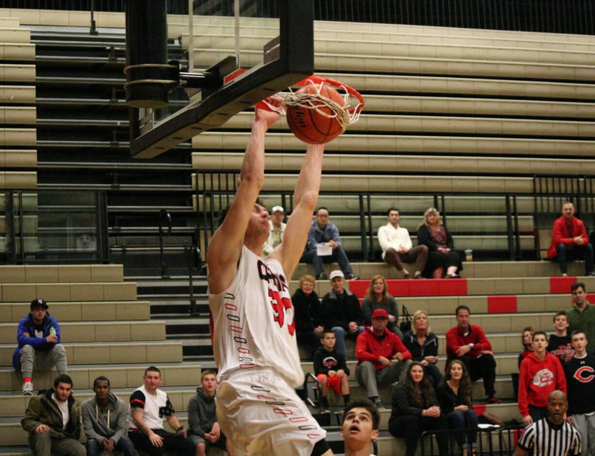 Trevor Jasinsky kick started the offense with a 3-pointer and this slam dunk Wednesday, at Camas High School. The Papermakers defeated Southridge, of Surrey, B.C., 56-40.