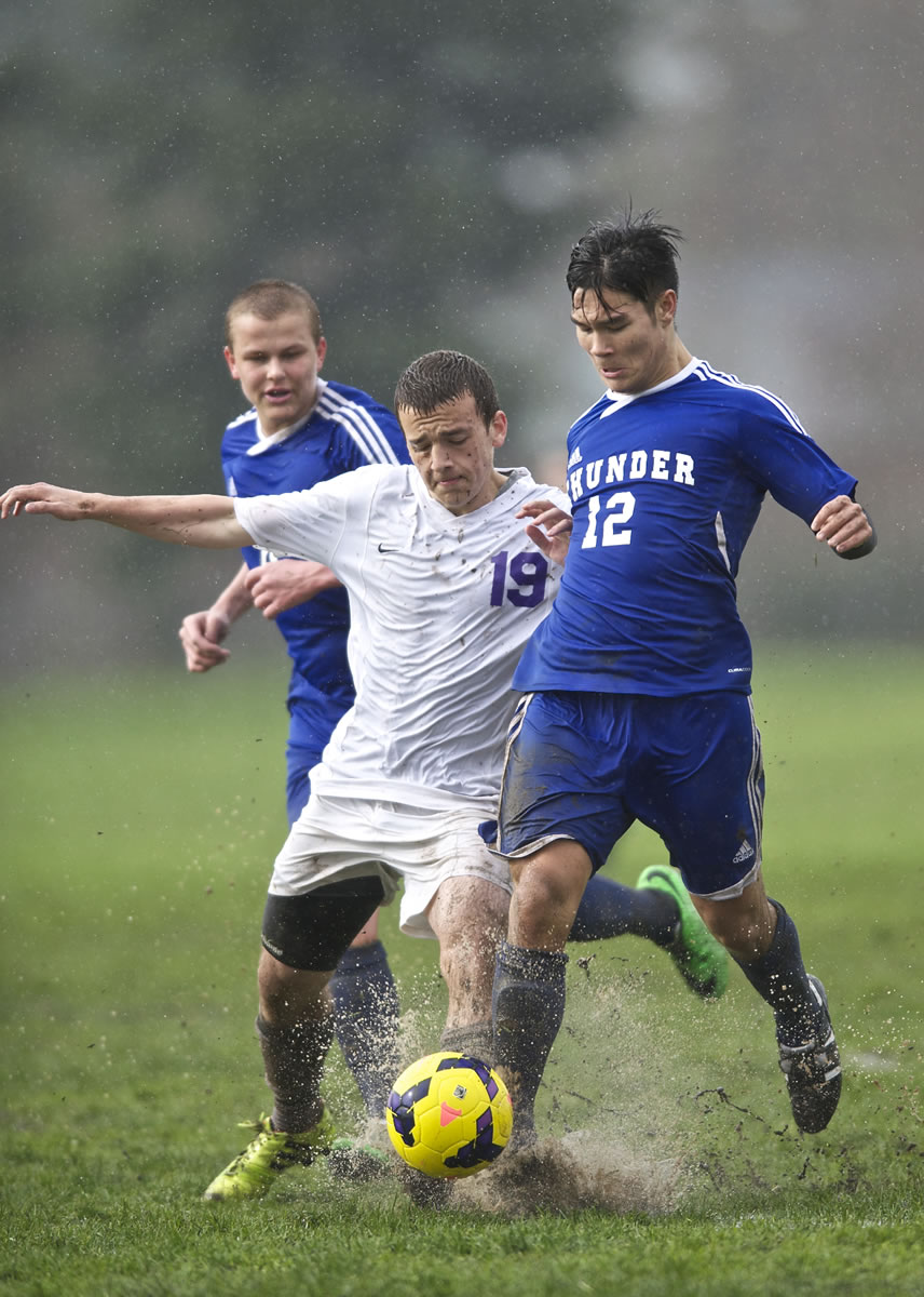 Mountain View's Isaac Strever (12), battling against Heritage High's Inas Mehmedovic (19) in Friday's match, missed last season when he was with the Portland Timbers Academy.