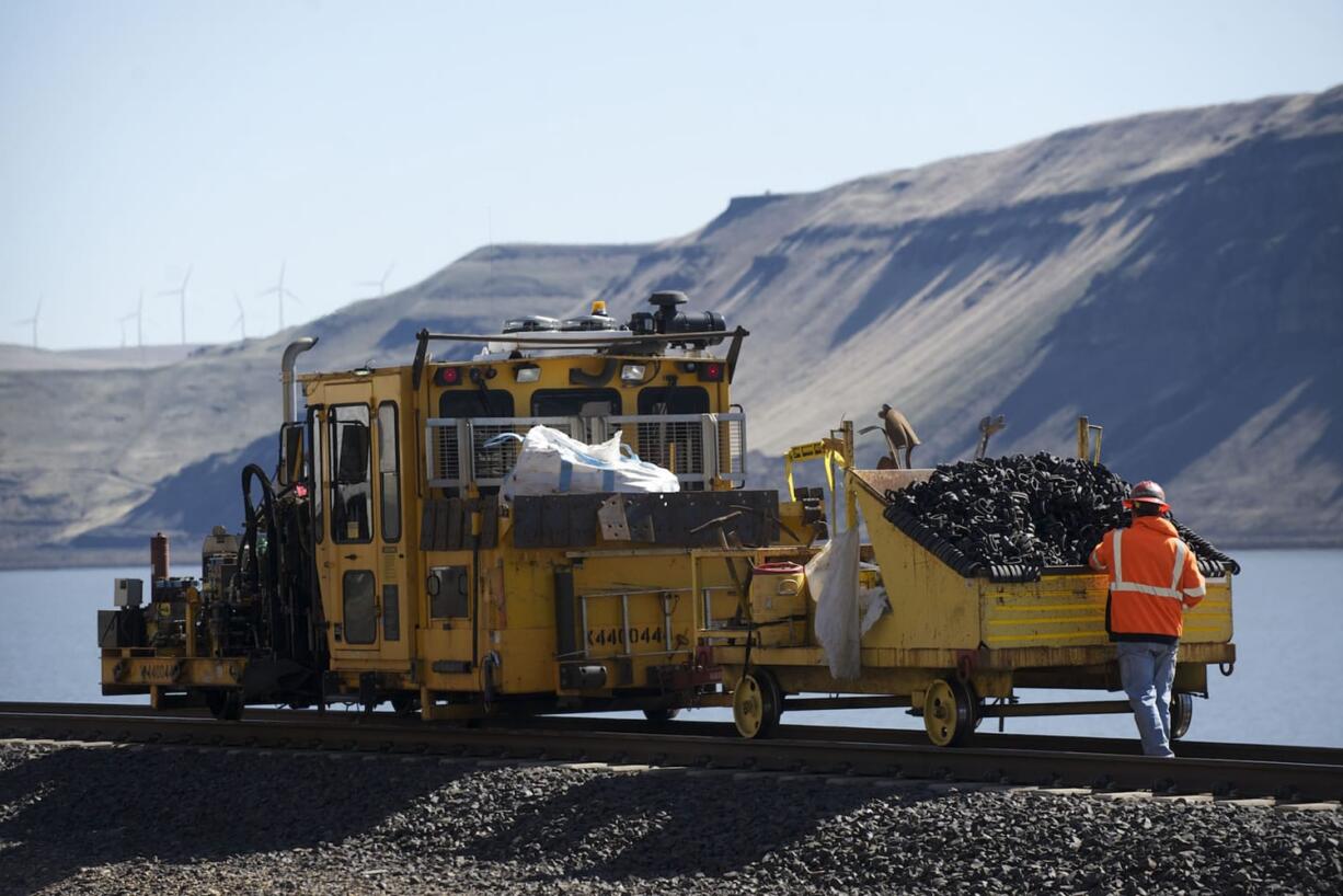 Photos by Steven Lane/The Columbian
A rail gang works on a section of track 36 miles east of Wishram and more than 120 miles from Vancouver. BNSF Railway will make record investments in rail improvements this year, including major changes on the Columbia River Gorge tracks east of Vancouver.