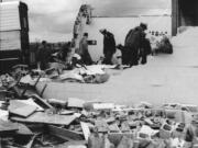 Officials look through the rubble after a tornado devastated Peter S. Ogden Elementary on April 5, 1972.