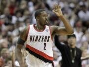 Portland Trail Blazers guard Wesley Matthews holds up three fingers after sinking a three point basket during an NBA basketball game Nov.