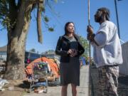 Vancouver City Councilor Alishia Topper talks recently with Calvin Chastang, who camps in downtown Vancouver. The community rallied early this year to rescue families at Courtyard Village Apartments from homelessness; now, more homeless people have been appearing on the streets of West Vancouver.