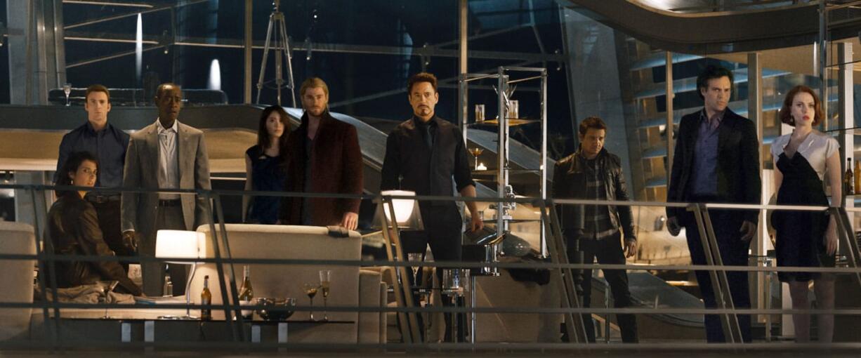 Cobie Smulders, from left, Chris Evans, Don Cheadle, Claudia Kim, Chris Hemsworth, Robert Downey Jr., Jeremy Renner, Mark Ruffalo and Scarlett Johansson in the film, &quot;Avengers: Age of Ultron.&quot; (Disney/Marvel)