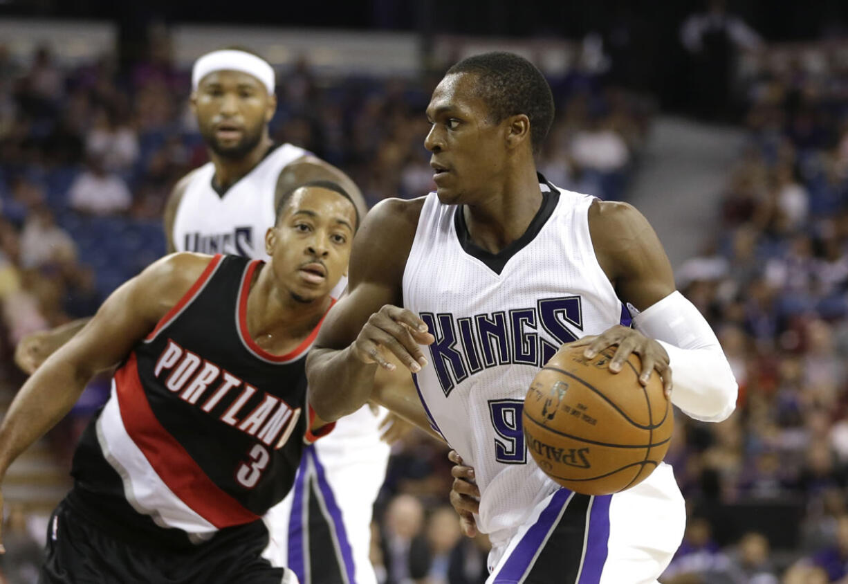 Sacramento's Rajon Rondo, right, drives against Portland Trail Blazers guard C.J. McCollum during a preseason game.