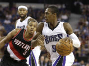 Sacramento's Rajon Rondo, right, drives against Portland Trail Blazers guard C.J. McCollum during a preseason game.