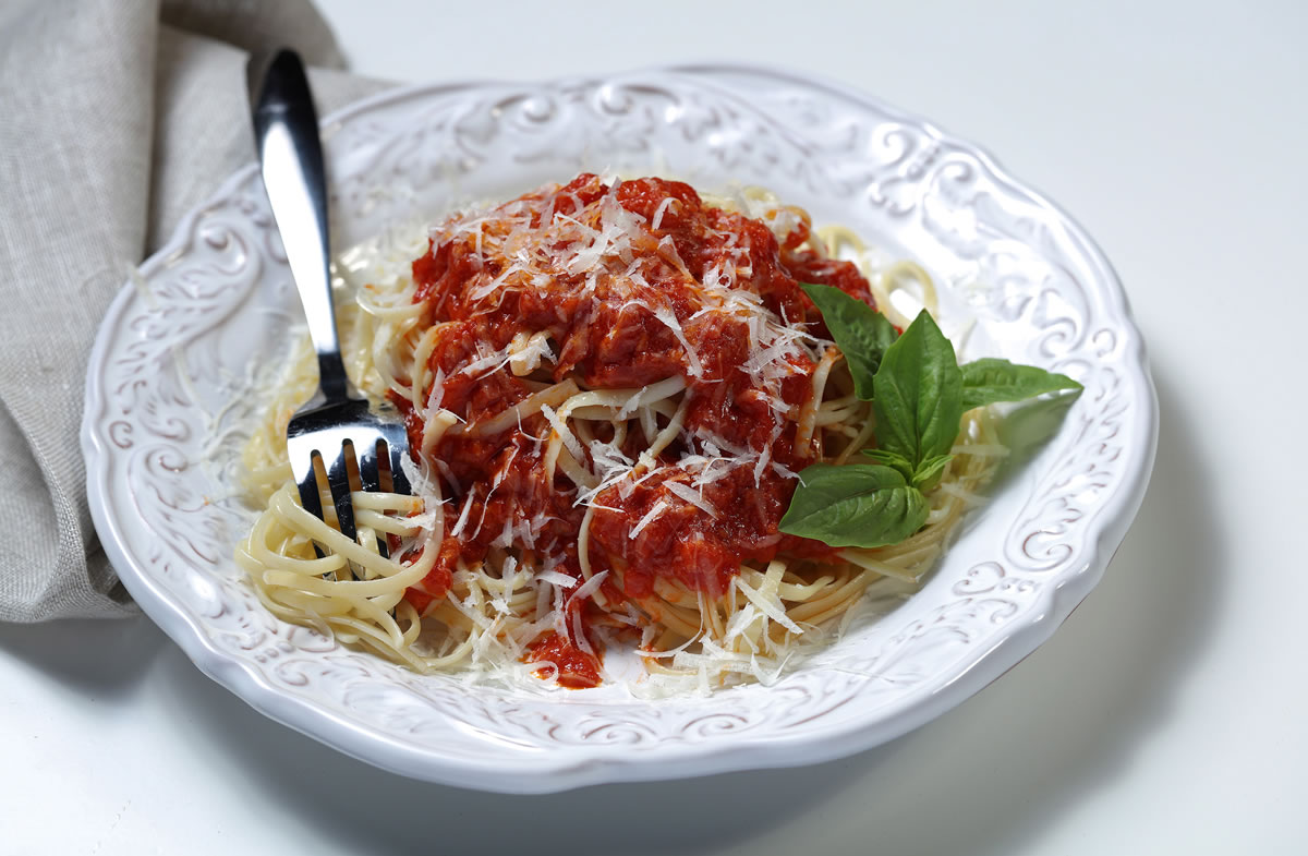 Chopped canned tomatoes simmer in butter, with a halved onion for flavor. When done, the onion is chucked and the sauce poured onto your favorite pasta. (E.