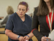 Tanya M. Leffler, shown here in an Aug. 26 court appearance,  has been ordered to remain in jail until her trial.