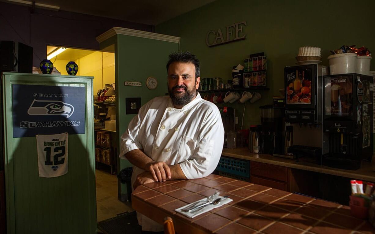 Scott Clement, taking a break from cooking at his Spring Lake Cafe in Fircrest, says most customers are shocked to learn he can&#039;t serve them a glass of wine or a beer. (Ellen M.