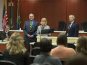 Acting County Manager Mark McCauley, from left, listens as Tom Mielke, Jeanne Stewart and David Madore of the Board of County Councilors issue a proclamation for disability employment awareness month Oct. 6 at the Clark County Public Service Center.