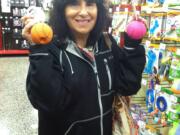 Phyllis Goddes of Langhorne, Pa., holds up two balls she&#039;s purchasing for her bichon fris?-shih tzu mix, Zoey Joy, at a Petco store in Feasterville, Pa.