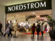 Shoppers leave Nordstrom at the Westfield Vancouver mall on Black Friday.