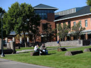 Students relax and study in the sun at Washington State University Vancouver on Sept. 10. WSU officials announced that 3,305 students enrolled for fall classes at the Salmon Creek campus.