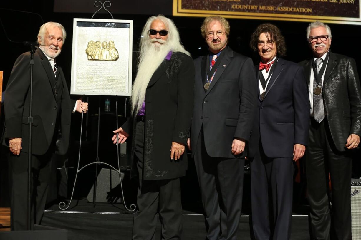 Kenny Rogers, from left, stands with The Oak Ridge Boys -- William Lee Golden, Duane Allen, Richard Sterbanseen and Joe Bonsall -- at The Country Music Hall of Fame 2015 Medallion Ceremony at Country Music Hall of Fame and Museum on Sunday in Nashville, Tenn.