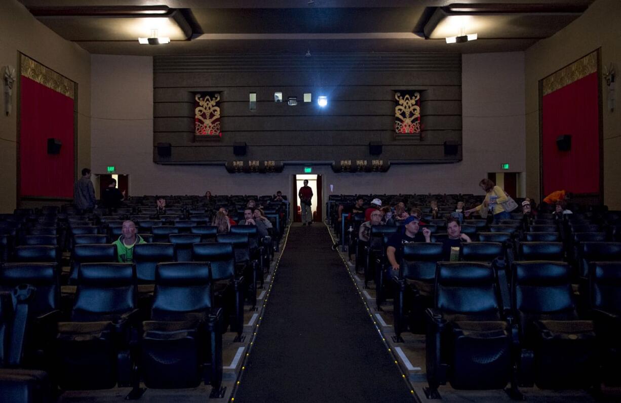 Moviegoers take their seat as they prepare to watch &quot;Back to the Future III&quot; on Oct. 21 at Kiggins Theatre in downtown Vancouver.