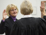 Clark County Councilor Jeanne Stewart is sworn in by Superior Court Judge Barbara Johnson during a ceremony at the Clark County Public Service Center on Monday.