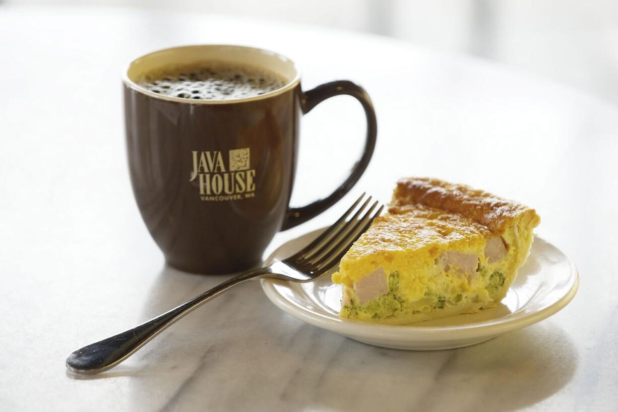 A cup of Anniversary Blend coffee and a slice of ham and broccoli quiche are offered at the Java House in Vancouver.