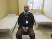 Lifeline Connections executive director Jared Sanford sits in a remodeled bedroom in the new &quot;sobering center&quot; on the ground floor of the Center for Community Health.