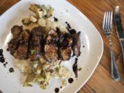 Blackberry pork tenderloin is served at Heathen Feral Public House in downtown Vancouver.