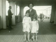 Eight-year-old Nan and 4-year-old Dorothy with their mother, aboard the RMS Aquitania.