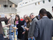 Columbia Way: Clark College engineering student Jesse Bosdell demonstrates a water clock at a Clark College Foundation event on March 15 at Christensen Shipyards.