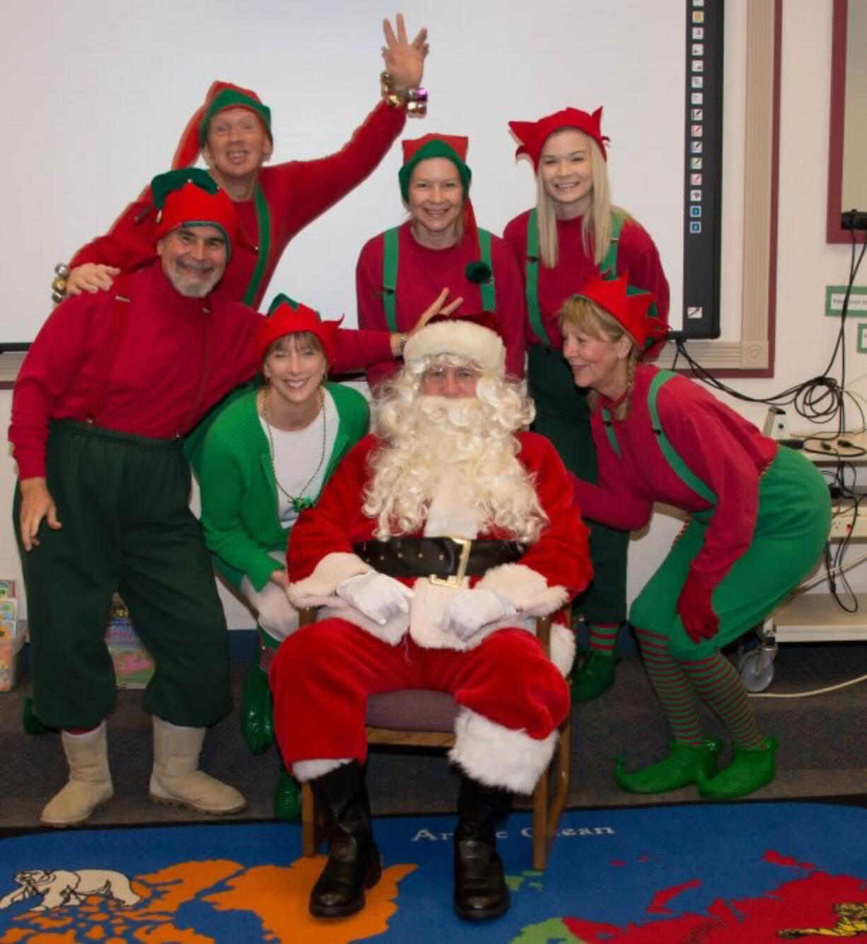 Vancouver: Members of the Rotary Club of Vancouver spread holiday cheer by dressing as elves and delivering gifts to kids at Roosevelt, Washington and King elementary schools on Dec.