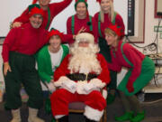 Vancouver: Members of the Rotary Club of Vancouver spread holiday cheer by dressing as elves and delivering gifts to kids at Roosevelt, Washington and King elementary schools on Dec.