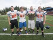 Ridgefield senior linemen (from left to right) Lane Andersen, Jack McGinley, Jesse Dobson, and Logan Black are not the biggest, but they make up for that with their intensity.